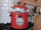 All American 921 pressure canner heating on stove